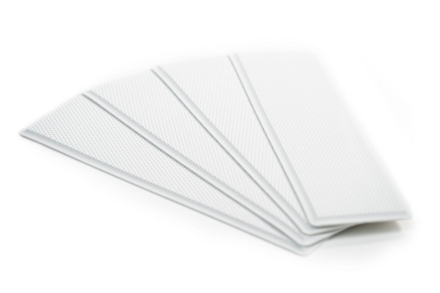 Self adhesive deck grip step pad